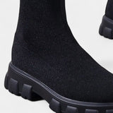 Женски ботуши до коляното с еластичен материал и закръглен нос с нисък блоков ток